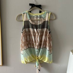 Sleeveless top with knot.